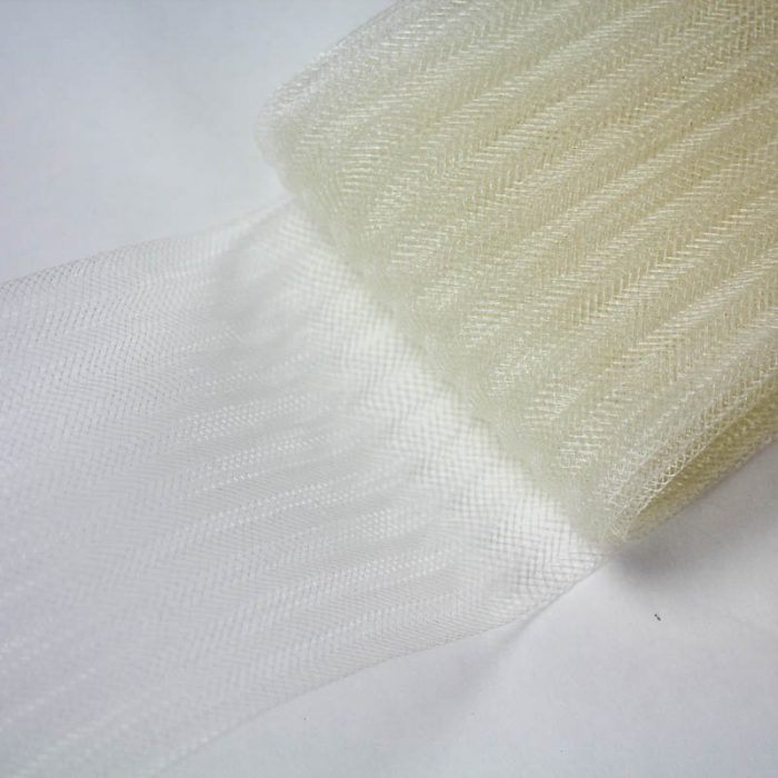 Ivory pleated horsehair with 1/4 inch pleating running through, parallel to length.