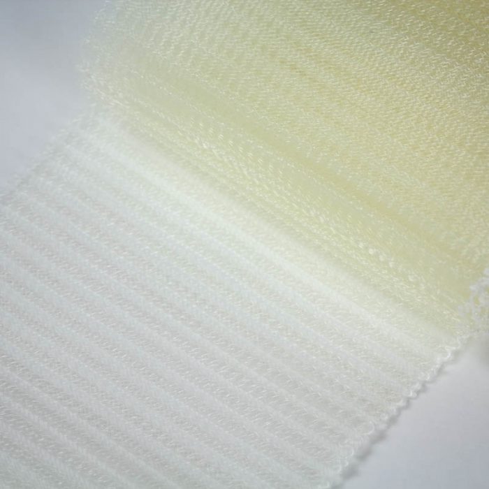 Ivory polyester, very flexible, 1/4 inch pleats.