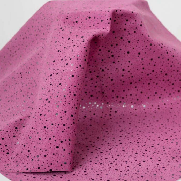 Black Dots pattern on pink pig suede. Supple and soft leather, thickness of .60mm, and blockable.