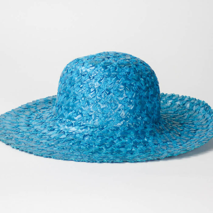 Vintage bright turquoise color in woven cellophane or onionskin straw. The edge of the brim has been wired but the crown can be blocked. There is no sweatband so I don't think this was ever worn as a hat.